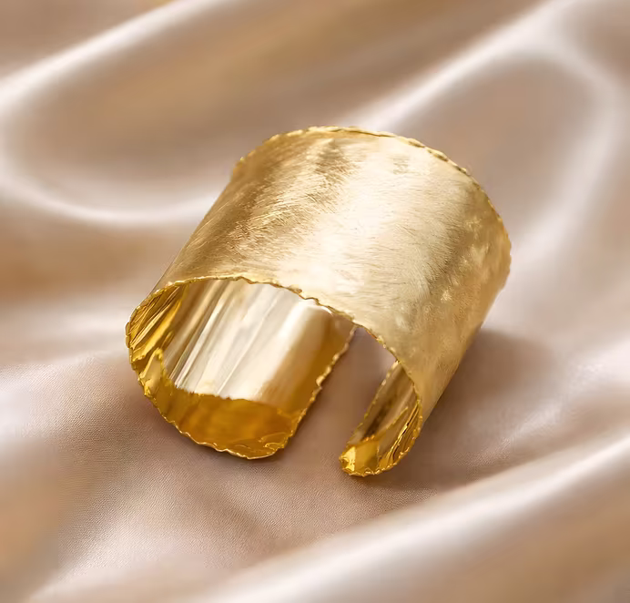 Curved ridged gold cuff